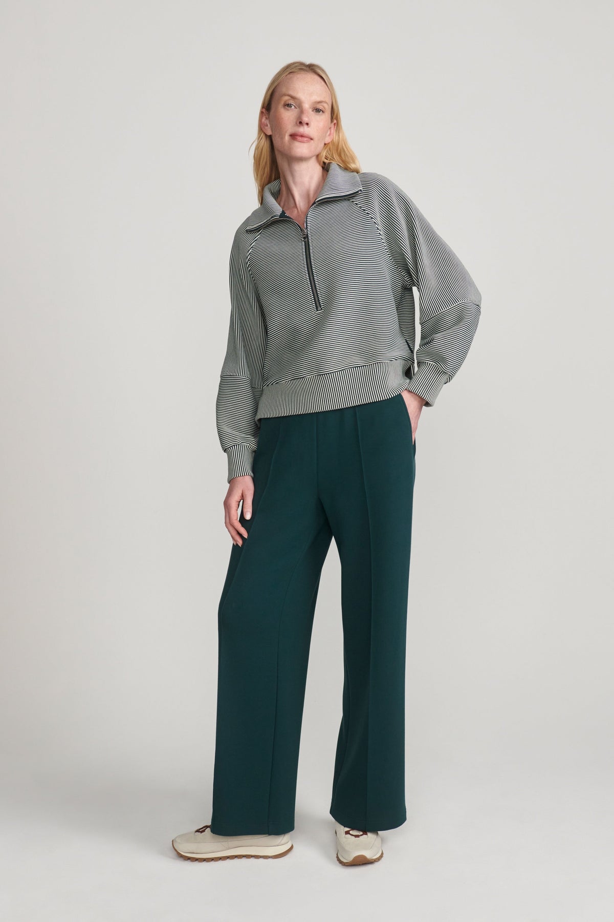 woman wearing green sweatshirt 