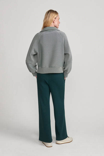 woman wearing green sweatshirt 