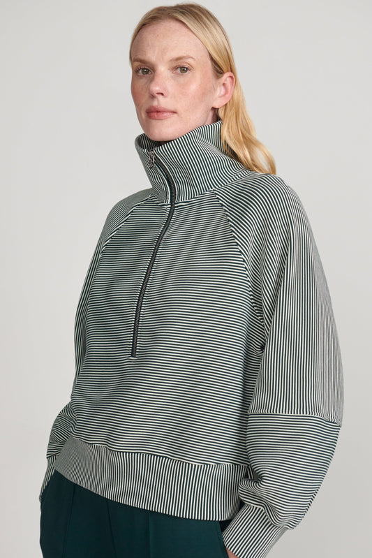 woman wearing green sweatshirt 