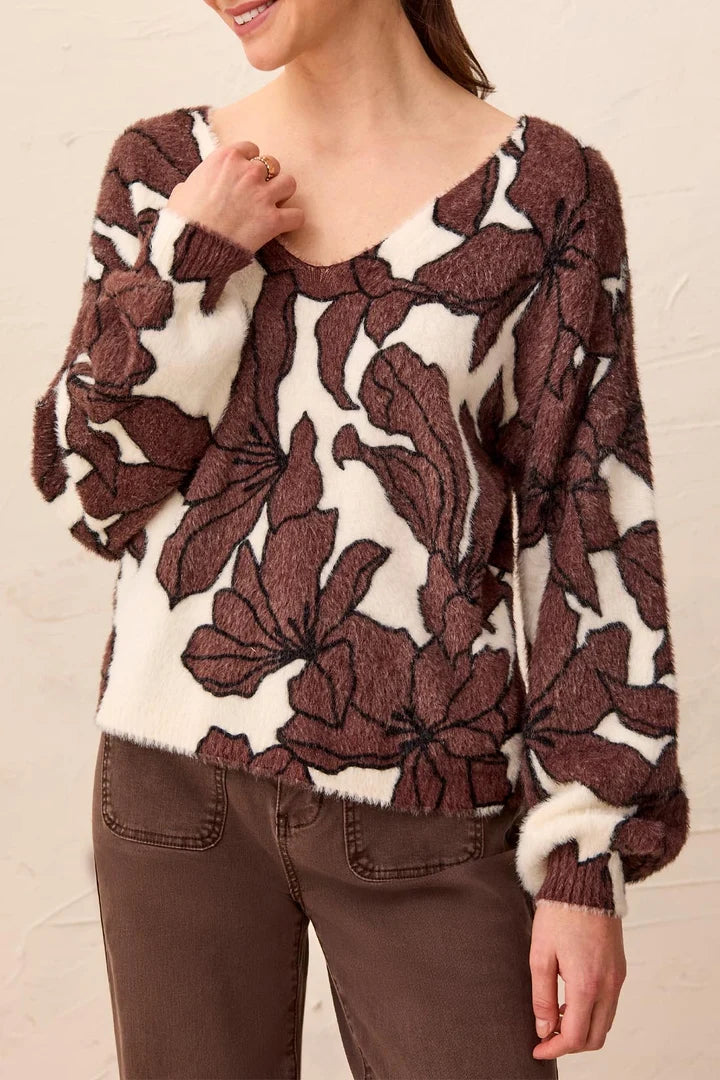 woman in brown floral sweater