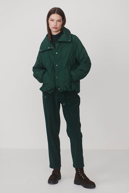 woman wearing coat and pants