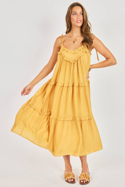 Woman wearing a yellow dress on a white background