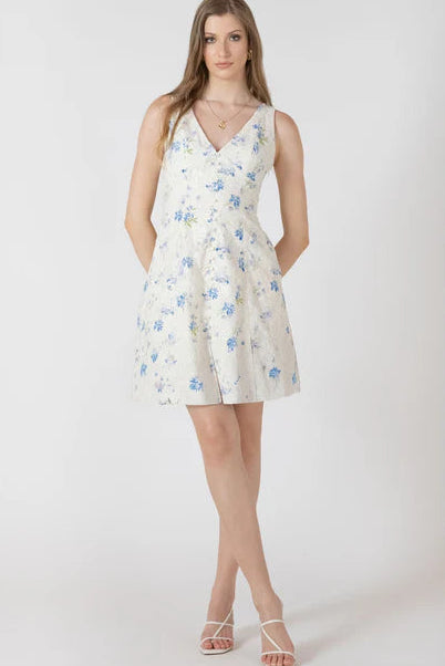 Woman wearing a floral dress on a white background