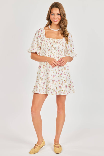 Woman wearing a floral dress on a white background