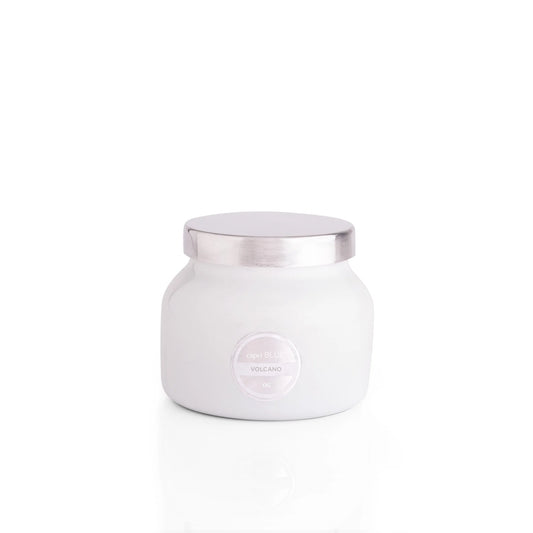 White jar with a silver lid on a white background