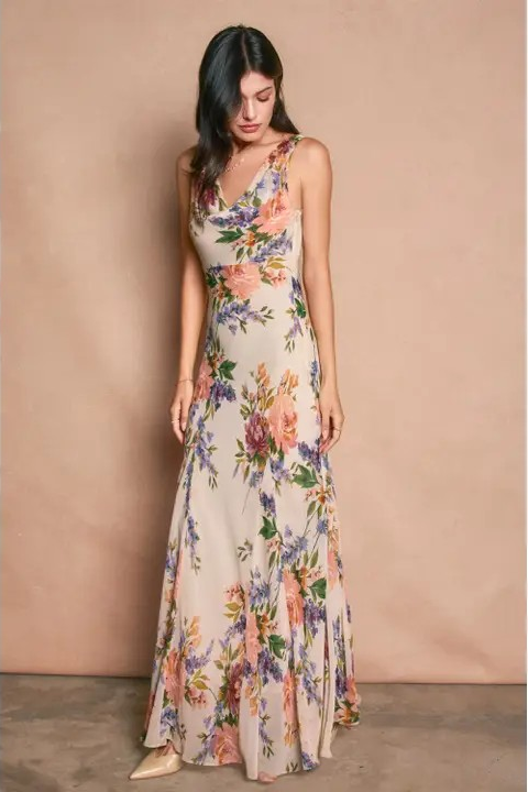 Woman wearing a floral dress against a beige background