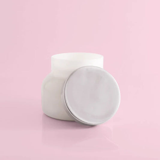 White ceramic jar on a pink background